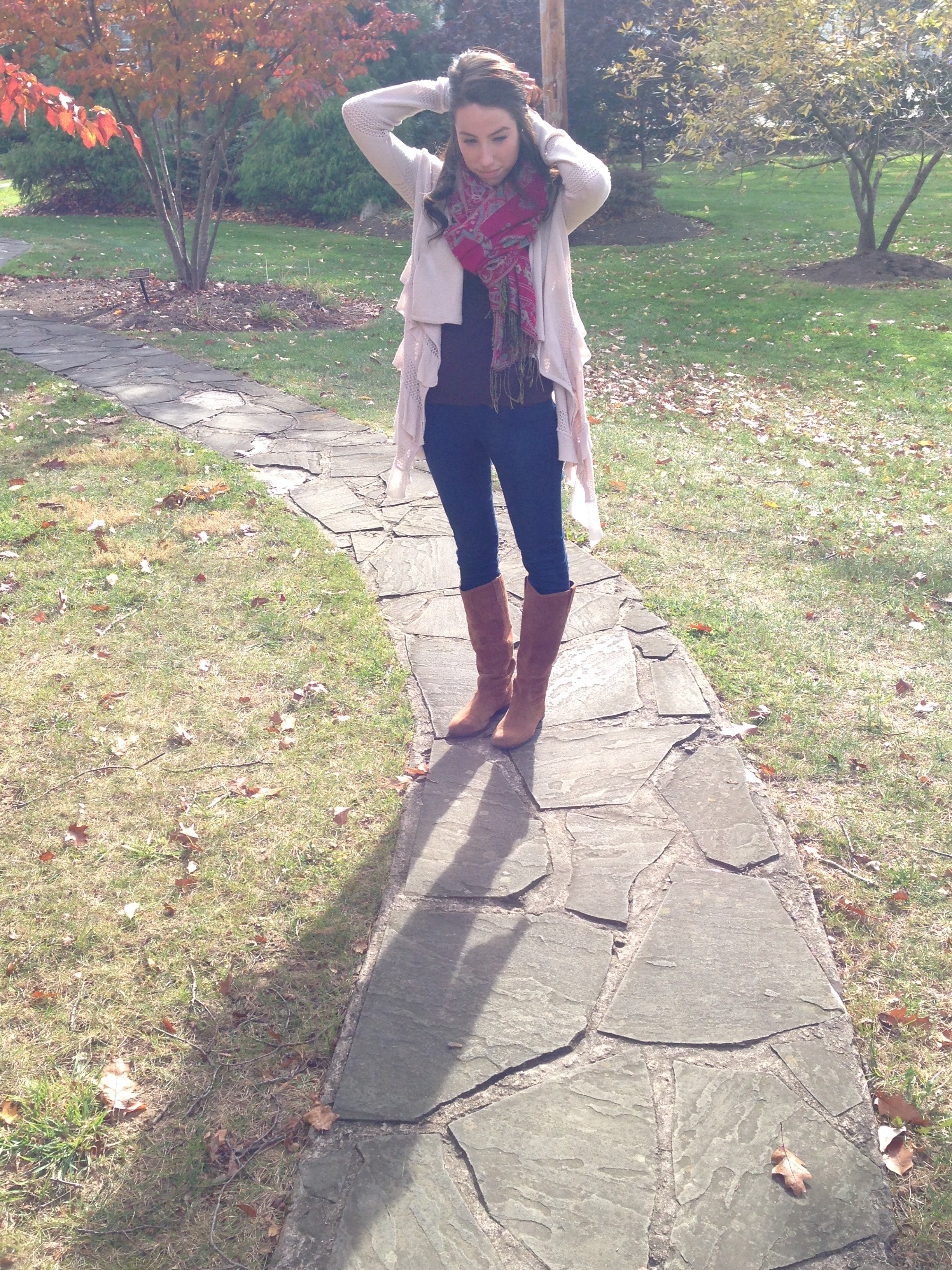 A fall cardigan, statement scarf, skinny jeans and boots