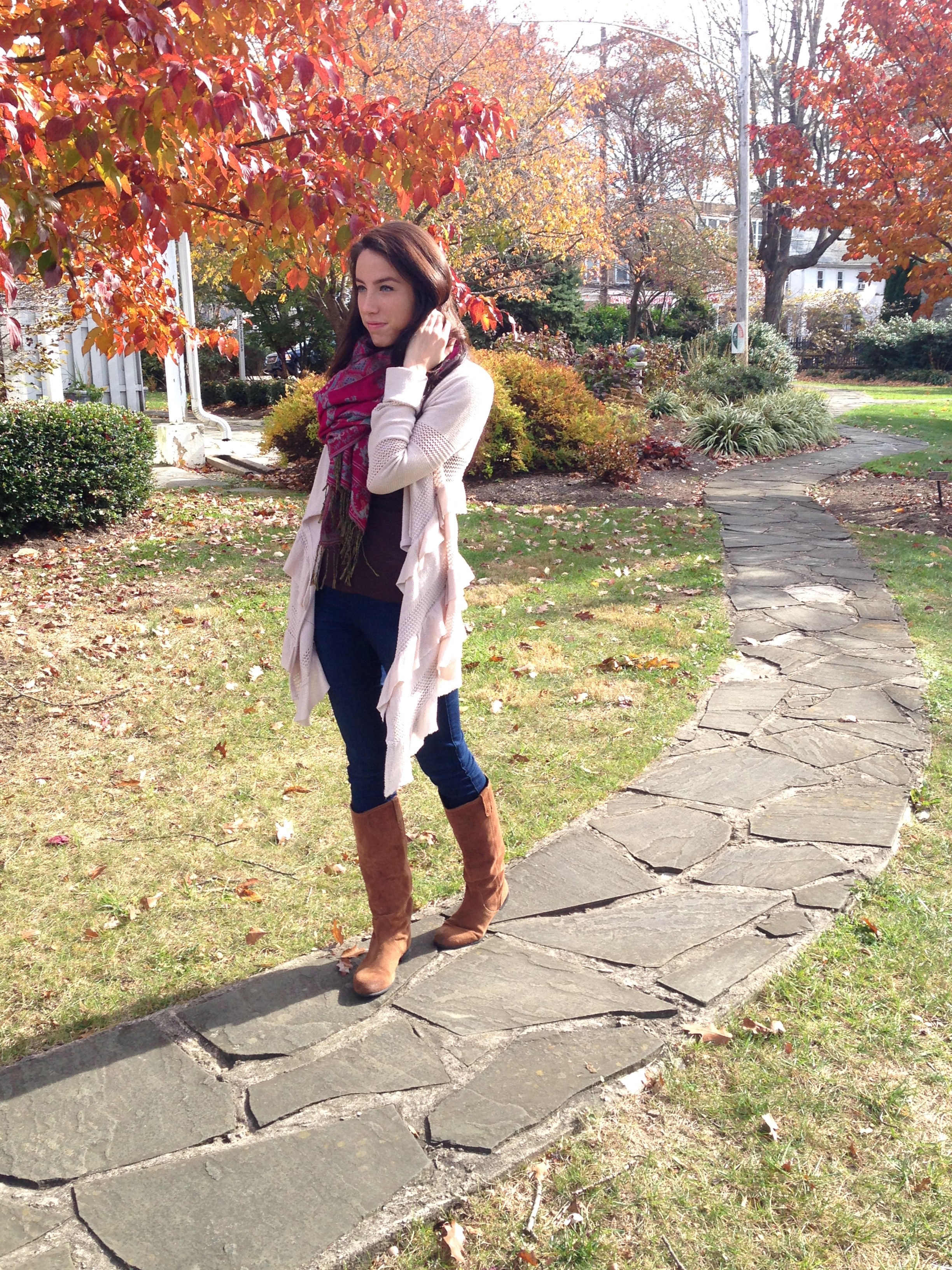 A fall cardigan, statement scarf, skinny jeans and boots